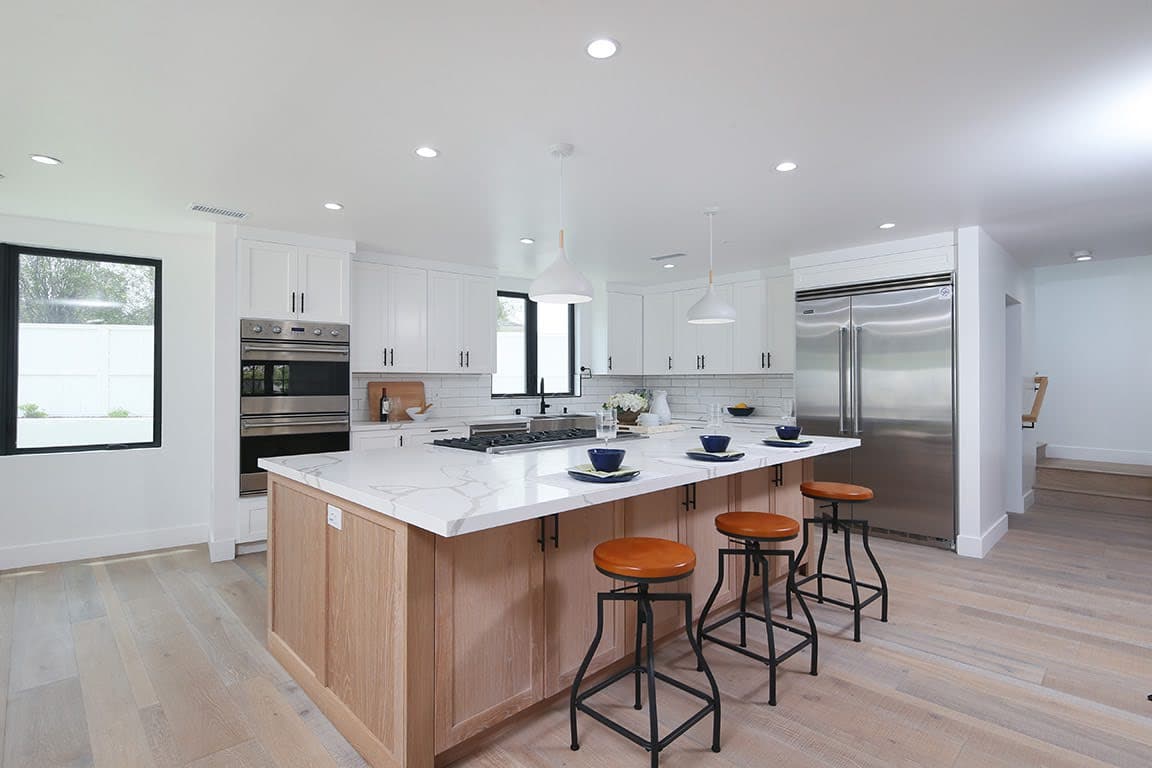 Open California-modern kitchen with a warm wood island