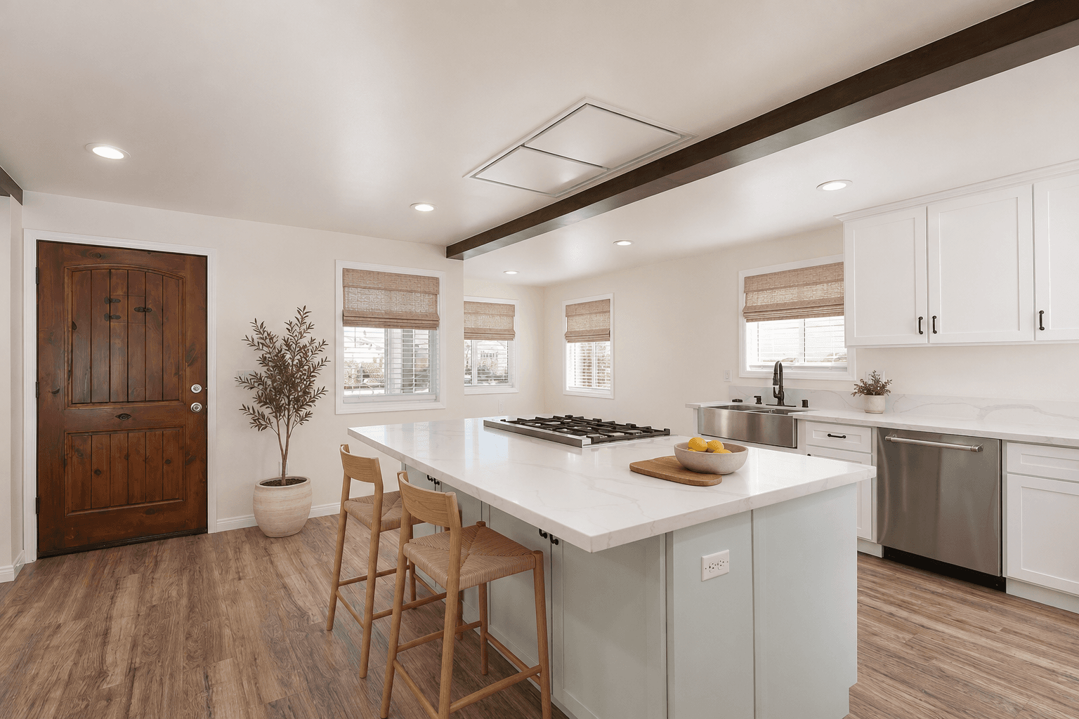 Renovated Los Angeles kitchen with a dark wood-clad structural beam